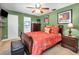 Bedroom featuring a ceiling fan and tropical-themed decor at 11236 116Th St, Largo, FL 33778