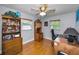 Comfortable bedroom featuring a ceiling fan, wood floors, and a well-lit, cozy interior at 11236 116Th St, Largo, FL 33778