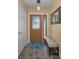 Welcoming entryway featuring decorative glass door, neutral paint, and tile flooring at 11236 116Th St, Largo, FL 33778