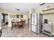 Charming kitchen with stainless steel refrigerator and cozy dining area at 11236 116Th St, Largo, FL 33778
