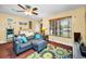 Inviting living area with a large window, comfortable seating, and stylish decor at 11236 116Th St, Largo, FL 33778