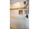 Walk-in shower featuring stone floor and black hardware at 11236 116Th St, Largo, FL 33778