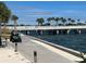 Scenic boardwalk along the water, featuring palm trees and a golf cart, capturing a tranquil and inviting atmosphere at 1137 Highland S St, St Petersburg, FL 33701