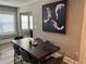 Dining room features a dark wood table, modern art, and great natural lighting at 1137 Highland S St, St Petersburg, FL 33701