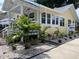 Charming yellow cottage with a well-manicured lawn, showcasing curb appeal and a welcoming atmosphere at 1137 Highland S St, St Petersburg, FL 33701