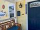 Inviting front porch with a cozy bench, complemented by a vibrant blue door, enhancing curb appeal and charm at 1137 Highland S St, St Petersburg, FL 33701