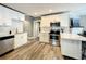 Modern kitchen with stainless steel appliances, white cabinets, countertops, and mosaic backsplash at 1137 Highland S St, St Petersburg, FL 33701