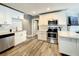 Updated kitchen featuring stainless appliances, a white countertop, and sleek cabinets with an open layout at 1137 Highland S St, St Petersburg, FL 33701