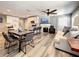 Spacious open-concept living room with a modern kitchen, a dining area, comfortable seating, and updated lighting at 1137 Highland S St, St Petersburg, FL 33701