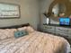 Comfortable bedroom featuring a decorative mirror and dresser, creating a peaceful and stylish retreat at 1137 Highland S St, St Petersburg, FL 33701
