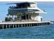 Modern pier with a sleek building and palm trees, offering a picturesque waterfront destination for leisure and enjoyment at 1137 Highland S St, St Petersburg, FL 33701
