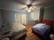Bright bedroom with light-colored walls and mixed-match beds at 12319 Memorial Hwy, Tampa, FL 33635