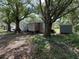 Cozy home nestled among mature trees offering plenty of shade at 12319 Memorial Hwy, Tampa, FL 33635