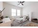Bright bedroom with large windows, neutral decor, and gray carpet featuring an adjacent workstation at 12646 Oak Hill Way, Parrish, FL 34219