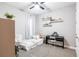 Cozy bedroom with a bed, piano, and open shelving for decorative items at 12646 Oak Hill Way, Parrish, FL 34219