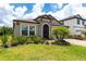 Charming single-story home with manicured lawn and stone accents at 12646 Oak Hill Way, Parrish, FL 34219