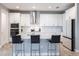 Contemporary kitchen with white cabinets, backsplash, and stainless steel appliances at 12646 Oak Hill Way, Parrish, FL 34219