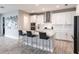 Open kitchen design with an island, barstool seating and stainless steel appliances at 12646 Oak Hill Way, Parrish, FL 34219