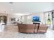 Bright living room featuring a fireplace, large windows and an open floor plan at 12646 Oak Hill Way, Parrish, FL 34219