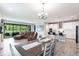 Open concept living space with a dining area, living room, and modern kitchen at 12646 Oak Hill Way, Parrish, FL 34219