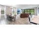 Open concept living space with a dining area, fireplace and view to the outside at 12646 Oak Hill Way, Parrish, FL 34219