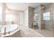 Beautiful bathroom featuring a soaking tub, separate shower, and modern tile at 12646 Oak Hill Way, Parrish, FL 34219