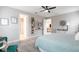 Serene primary bedroom with a view of the bathroom, and natural light at 12646 Oak Hill Way, Parrish, FL 34219