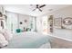 Spacious main bedroom with a view into the bathroom and natural lighting at 12646 Oak Hill Way, Parrish, FL 34219