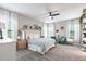 Bright and airy main bedroom boasts ample space and stylish décor at 12646 Oak Hill Way, Parrish, FL 34219