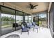 Comfortable outdoor living space on the patio with seating and water views at 12646 Oak Hill Way, Parrish, FL 34219