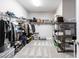 Spacious walk-in closet features custom shelving, rods, and storage for organization at 12646 Oak Hill Way, Parrish, FL 34219