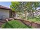Backyard view with patio access to the home, landscaping, and a fenced yard at 13747 Forest Ridge Ct, Hudson, FL 34667