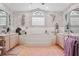 Luxurious bathroom with a large bathtub and a stylish arched window at 13747 Forest Ridge Ct, Hudson, FL 34667