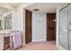 Well-appointed bathroom with a shower and storage at 13747 Forest Ridge Ct, Hudson, FL 34667