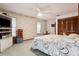 Comfortable bedroom featuring a ceiling fan and a view of the exterior at 13747 Forest Ridge Ct, Hudson, FL 34667