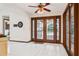 Dining room with access to the kitchen and views of the outdoor patio through French doors at 13747 Forest Ridge Ct, Hudson, FL 34667