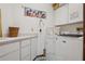 Laundry room featuring modern appliances and ample storage space at 13747 Forest Ridge Ct, Hudson, FL 34667