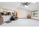 Spacious living room featuring tile floors, fan with lights, and lots of natural light at 13747 Forest Ridge Ct, Hudson, FL 34667
