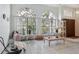 Bright living room featuring large windows and neutral-toned flooring at 13747 Forest Ridge Ct, Hudson, FL 34667