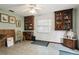 Inviting living room with tile floors, display cabinets, and bright natural light at 13747 Forest Ridge Ct, Hudson, FL 34667