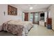 Spacious main bedroom with patio access and an abundance of natural light at 13747 Forest Ridge Ct, Hudson, FL 34667