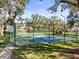 Community pickleball court for friendly matches, with well-maintained fencing and signage, offering a recreational amenity at 13747 Forest Ridge Ct, Hudson, FL 34667
