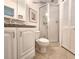 Guest bathroom featuring a walk-in shower and vanity with good lighting at 14113 Cypress Cir, Tampa, FL 33618
