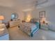Serene bedroom featuring bright natural light and neutral tile flooring at 14113 Cypress Cir, Tampa, FL 33618