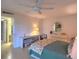 Bright bedroom featuring tile floors, vanity area, and natural lighting at 14113 Cypress Cir, Tampa, FL 33618