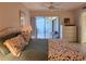 Tranquil bedroom with tile floor, patio access, and stylish decor at 14113 Cypress Cir, Tampa, FL 33618