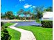 Exterior view of a contemporary home with lush lawn and sidewalk at 14113 Cypress Cir, Tampa, FL 33618