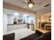Comfortable sitting area featuring custom shelving, a ceiling fan and skylights for plenty of light at 14113 Cypress Cir, Tampa, FL 33618