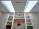 Bright study featuring custom built-in shelving with decorative accents and a large skylight at 14113 Cypress Cir, Tampa, FL 33618