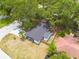 Aerial view of home with dark roof and fully fenced yard at 1608 Carlos Ave, Clearwater, FL 33755